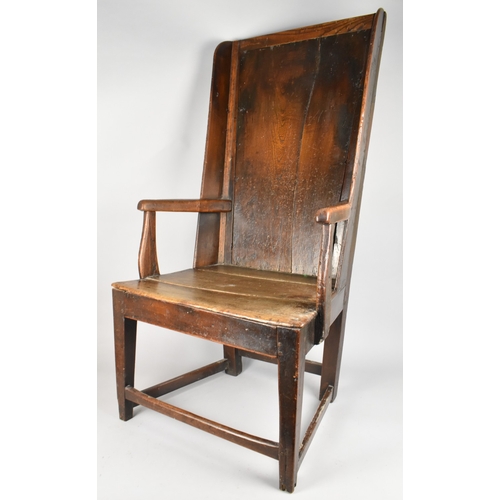 367 - An 18th/19th Century English Elm Lambing Chair with Winged Back, Three Panel Seat, Shaped Arms and S... 