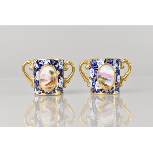 262 - A Pair of Late 19th/Early 20th Century Miniature Loving Mugs with Hand Painted Oval Landscape Cartou... 