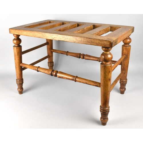 97 - A 19th Century Ash Luggage Stand with a Slatted Top Supported on Turned Legs and Stretcher, 61x36x43... 