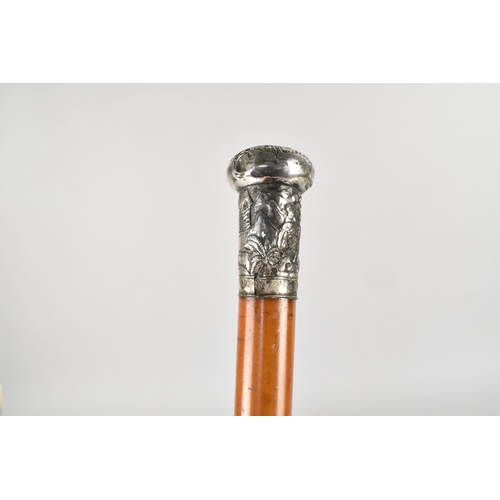 139 - A 19th Century Chinese Malacca Walking Cane with an Unmarked Silver Top Moulded with Chinese Figures... 