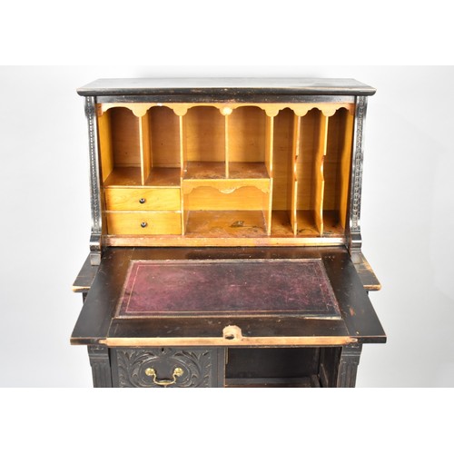 100 - A Late 19th Century Carved Oak Clerk's Bureau with Centre Long Drawer, Two Small Base Drawers, Pull ... 