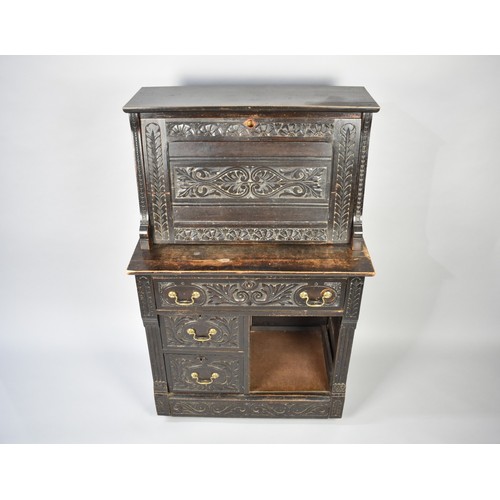 100 - A Late 19th Century Carved Oak Clerk's Bureau with Centre Long Drawer, Two Small Base Drawers, Pull ... 