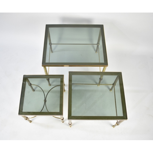 123 - A Late 20th century Nest of Three Graduated Brass Based and Smoked Glass Tables, 56cms Wide