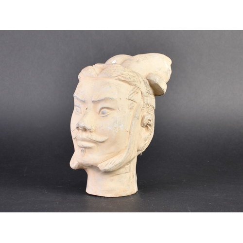 131 - A Clay Miniature Bust of Terracotta Warrior Head, 19cms High