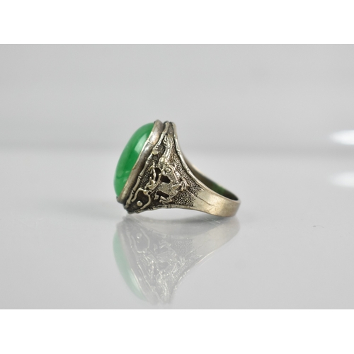 514 - A Jade Type Stone Oval Cabochon Ring Having Bamboo and Dragon Decoration to Shoulders, Unmarked Whit... 