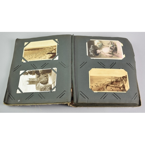 53 - An Early 20th Century Postcard Album Containing Mixed Cards, Coloured and Monochrome