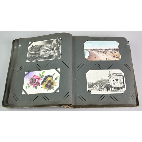 53 - An Early 20th Century Postcard Album Containing Mixed Cards, Coloured and Monochrome