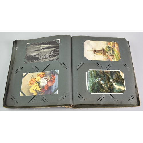 53 - An Early 20th Century Postcard Album Containing Mixed Cards, Coloured and Monochrome