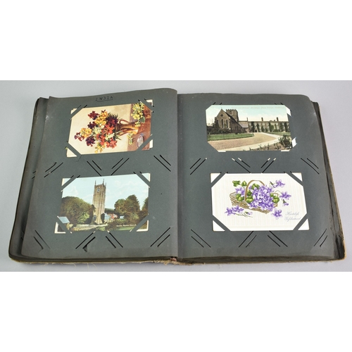 53 - An Early 20th Century Postcard Album Containing Mixed Cards, Coloured and Monochrome