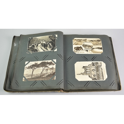 53 - An Early 20th Century Postcard Album Containing Mixed Cards, Coloured and Monochrome