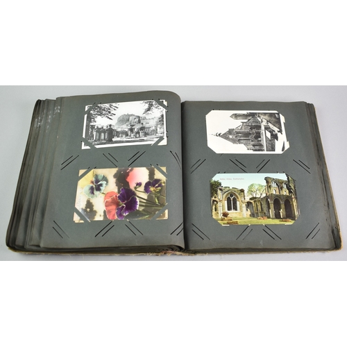 53 - An Early 20th Century Postcard Album Containing Mixed Cards, Coloured and Monochrome