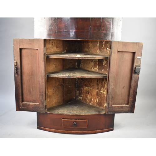 573 - A 19th Century Bow Fronted Mahogany Wall Hanging Corner Cabinet with Small Base Drawer, 88cms Wide a... 