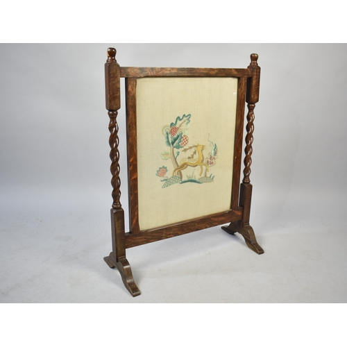 605 - A Mid 20th Century Oak Framed Tapestry Fire Screen with Barley Twist Supports, 59cms Wide