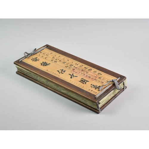 608 - A Reproduction Chinese Wooden Bound Book Depicting Elegant Fashion Prints, 38cms by 18.5cms