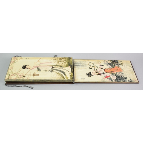 608 - A Reproduction Chinese Wooden Bound Book Depicting Elegant Fashion Prints, 38cms by 18.5cms