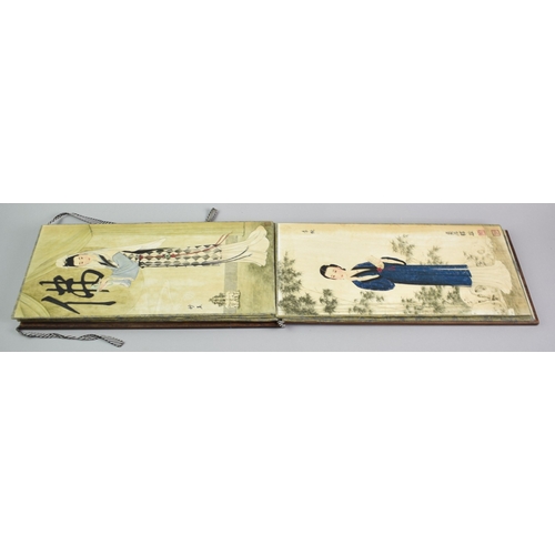 608 - A Reproduction Chinese Wooden Bound Book Depicting Elegant Fashion Prints, 38cms by 18.5cms