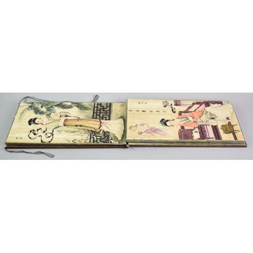 608 - A Reproduction Chinese Wooden Bound Book Depicting Elegant Fashion Prints, 38cms by 18.5cms