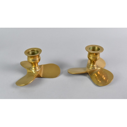 123 - A Pair of Novelty Brass Candlesticks in the Form of Ships Propellors, 6cms High