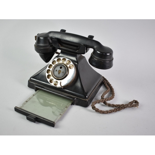 130 - An Early 20th Century Black Bakelite Telephone with Pull Out Number Drawer