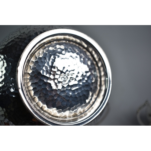 141 - A Silver Plated Britannia Metal Three Piece Tea Service with Hammered Decoration