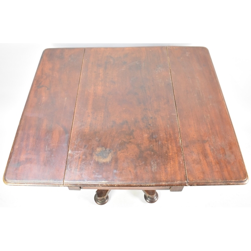 170 - A 19th Century Mahogany Drop Leaf Table having Octagonal Stand Quadrant Base and Bun Feet with Casto... 