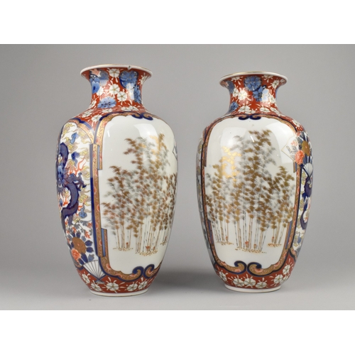 253 - A Pair of Japanese Fukagawa Type Porcelain Imari Vases Decorated with Panels to Include Dragon, Foli... 