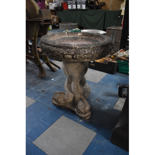 416 - A Reconstituted Stone Circular Birdbath, Tripod Dolphin Supports, 50cms Diameter and 55cms High