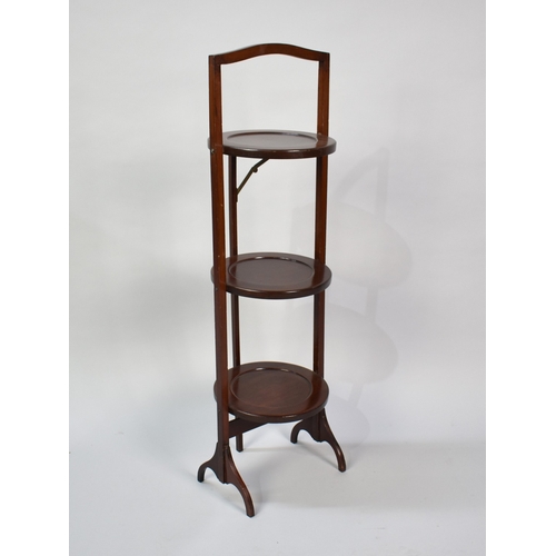 68 - An Edwardian Mahogany Three Tier Folding Cake Stand
