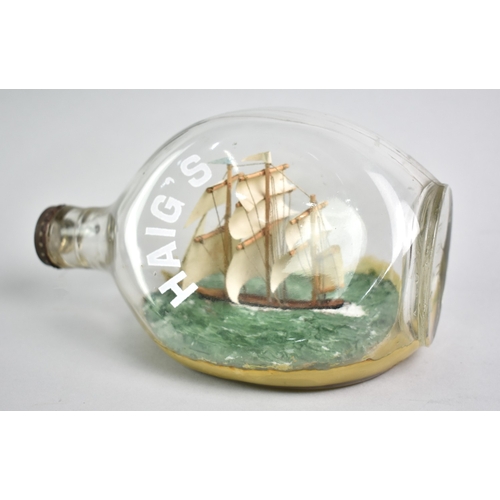 9 - A Folk Art Ship in a Dimple Bottle, 20cms Long