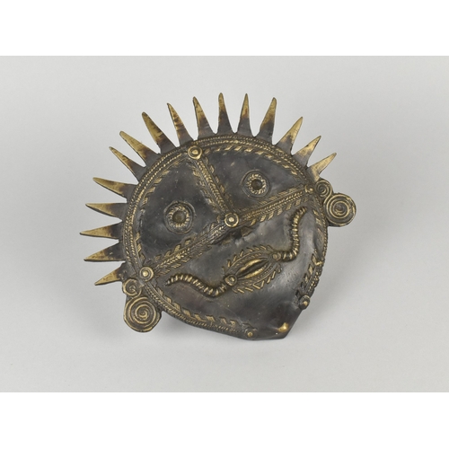 8 - An Indian Cast Metal Tribal Mask Using The Dhokra Technique, 20cms Diameter, Patinated Bronze