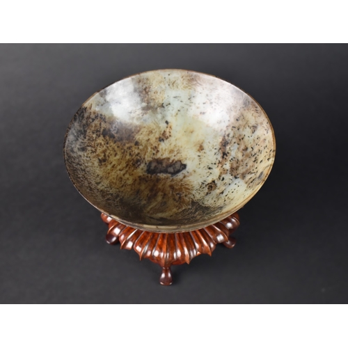 55 - A Chinese Hardstone Bowl on Carved Wooden Stand, 17cms Diameter