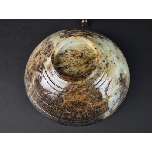 55 - A Chinese Hardstone Bowl on Carved Wooden Stand, 17cms Diameter