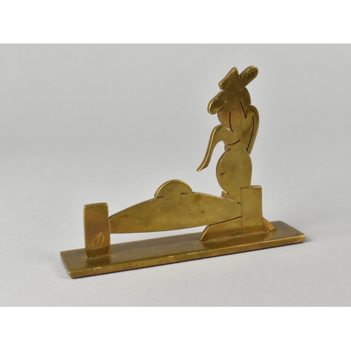 30 - An Art Deco Signed Brass Cut Fret Desk Ornament In The Form Of What Appears To Be a  Lady with Fedor... 