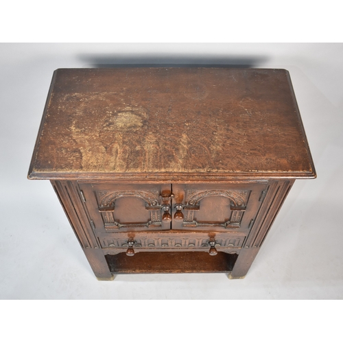 38 - A Mid 20th Century Carved Oak Side Cabinet with Panelled Doors and Base Drawer, Stretcher Shelf, 68c... 