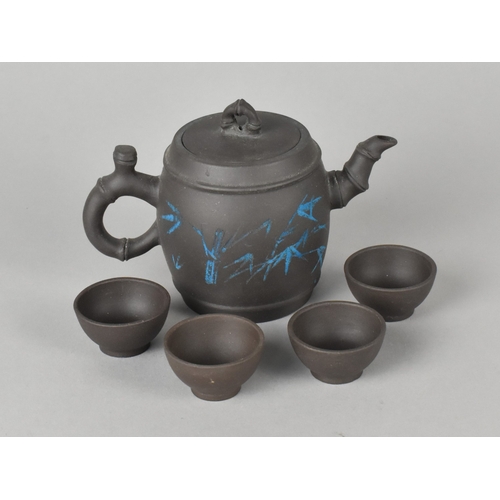 45 - A Chinese Yixing Teapot and Four Miniature Tea Bowl Set, Teapot Body Decorated in Blue Enamel with B... 