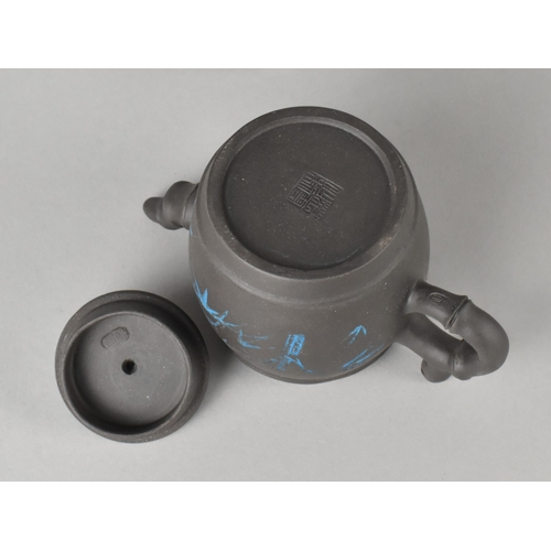 45 - A Chinese Yixing Teapot and Four Miniature Tea Bowl Set, Teapot Body Decorated in Blue Enamel with B... 