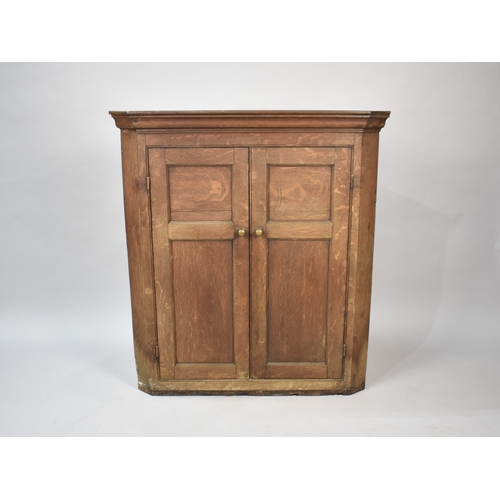 526 - A Late 19th Century Oak Wall Hanging Corner Cabinet with Panelled Doors, 88cms Wide