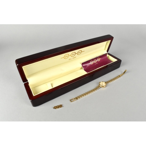 48 - A 9ct Gold Cased Watch by WH Wilmot, Mother of Pearl Face with Gilt Coloured Hands and Baton Hour In... 