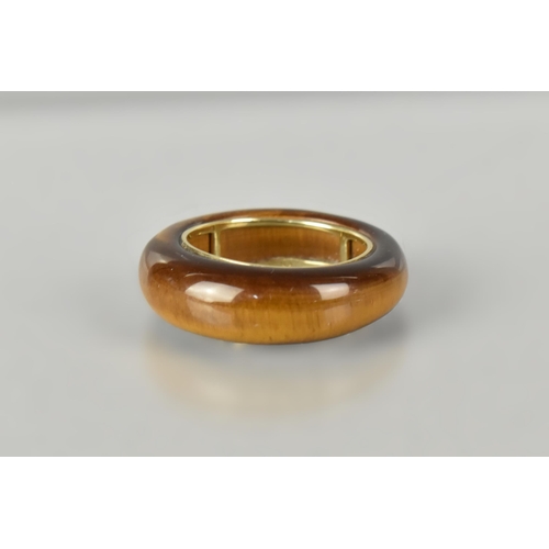 26 - A 9ct Gold Mounted Tigers Eye Ring, Polished and Tapered Tigers Eye Band 8.1mm Wide (At Widest Point... 