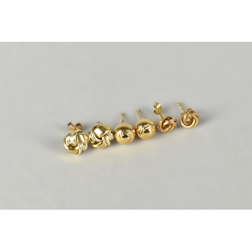 28 - Three Pairs of 9ct Gold Earrings to Comprise Two Knot Examples and a Spherical Pair with Fluted Deco... 
