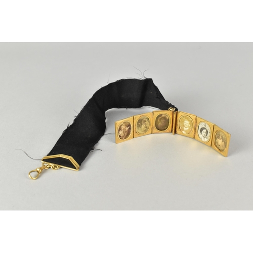 12 - A Rare Victorian Six Panel Locket in the Form of a Folding Tooled Leather Bound Book Containing Vari... 