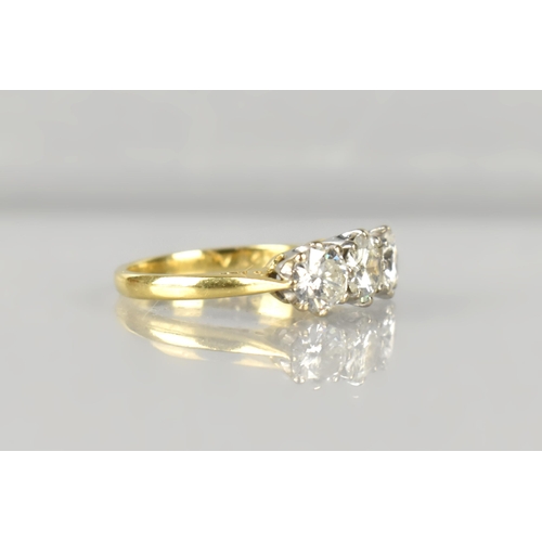 5 - A Three Stone Diamond Ring, Central Round Cut Stone Measuring 5.39mm Diameter, Side Diamonds 5.18mm ... 