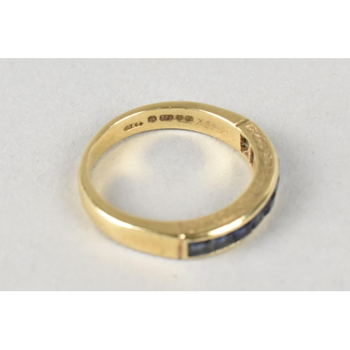 16 - A Sapphire Mounted 9ct Gold Half Eternity Ring, Channel Set Square Cut Stones in a Rectangular Reces... 