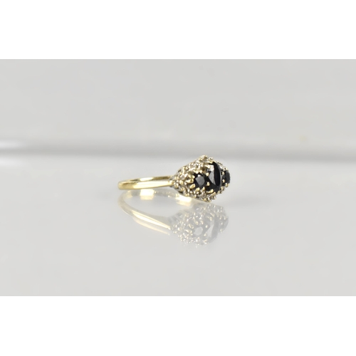17 - A 9ct Gold, Sapphire and Diamond Cluster Ring, Primary Oval Cut Sapphire Measuring 5.2mm by 3.5mm, S... 