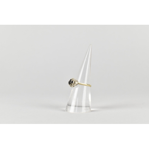 17 - A 9ct Gold, Sapphire and Diamond Cluster Ring, Primary Oval Cut Sapphire Measuring 5.2mm by 3.5mm, S... 