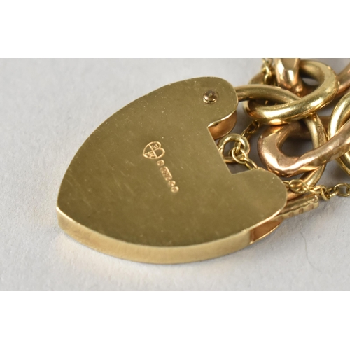 18 - A Heavy 9ct Gold Cuban Style Link Bracelet with Heart Shaped Padlock Clasp, 24gms