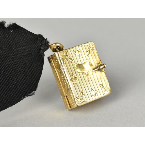 12 - A Rare Victorian Six Panel Locket in the Form of a Folding Tooled Leather Bound Book Containing Vari... 