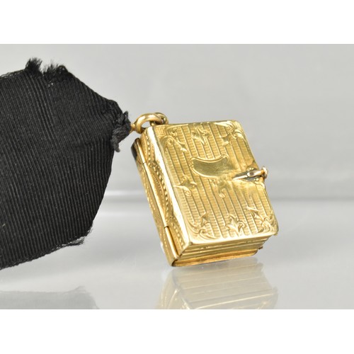 12 - A Rare Victorian Six Panel Locket in the Form of a Folding Tooled Leather Bound Book Containing Vari... 