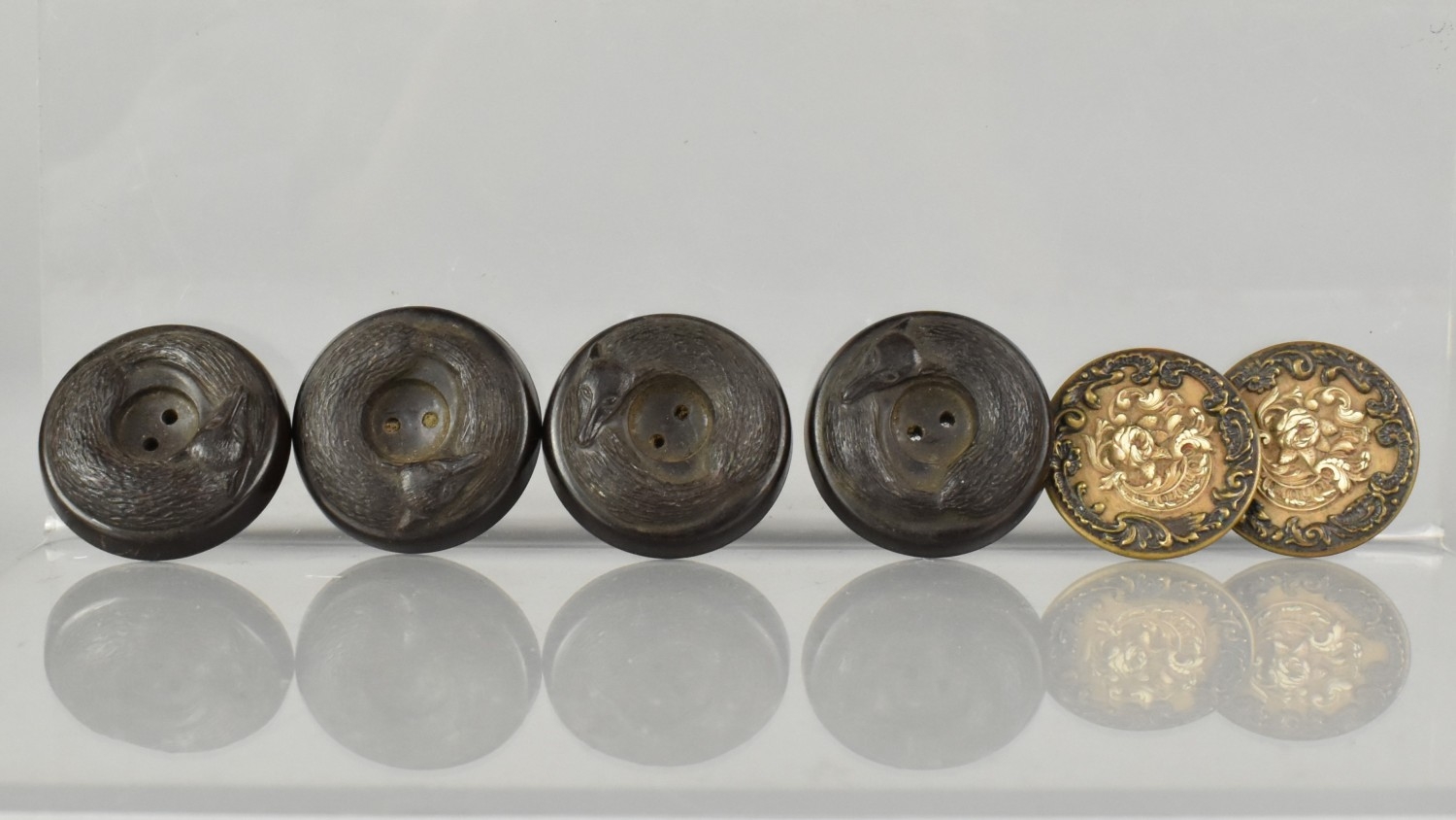 A Collection of Four Bakelite Buttons in the Form of Curled Foxes and ...