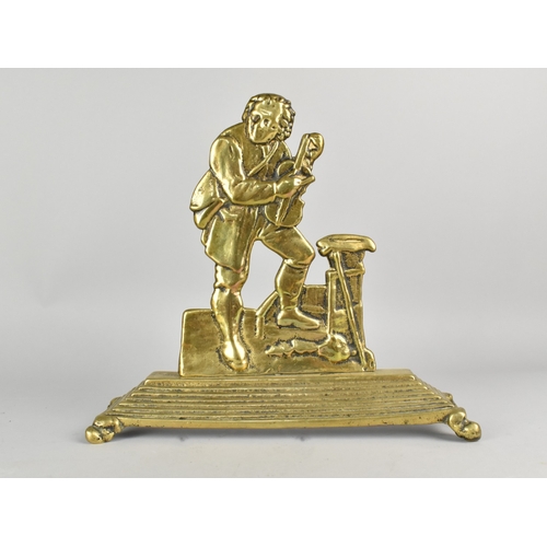 2 - A Victorian Brass doorstop in the form of a musician, with violin, 26cm high